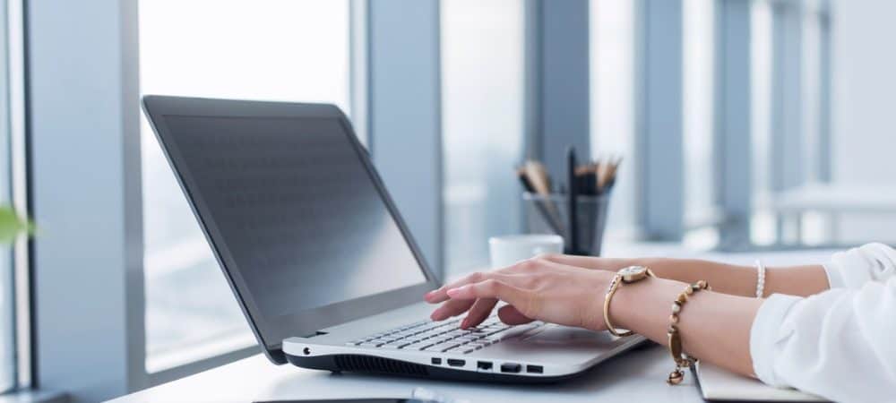 woman writing computer featured