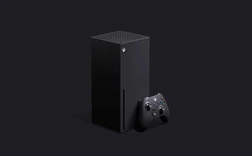 xbox x -sarjan konsoli ja ohjain mustalla taustalla 